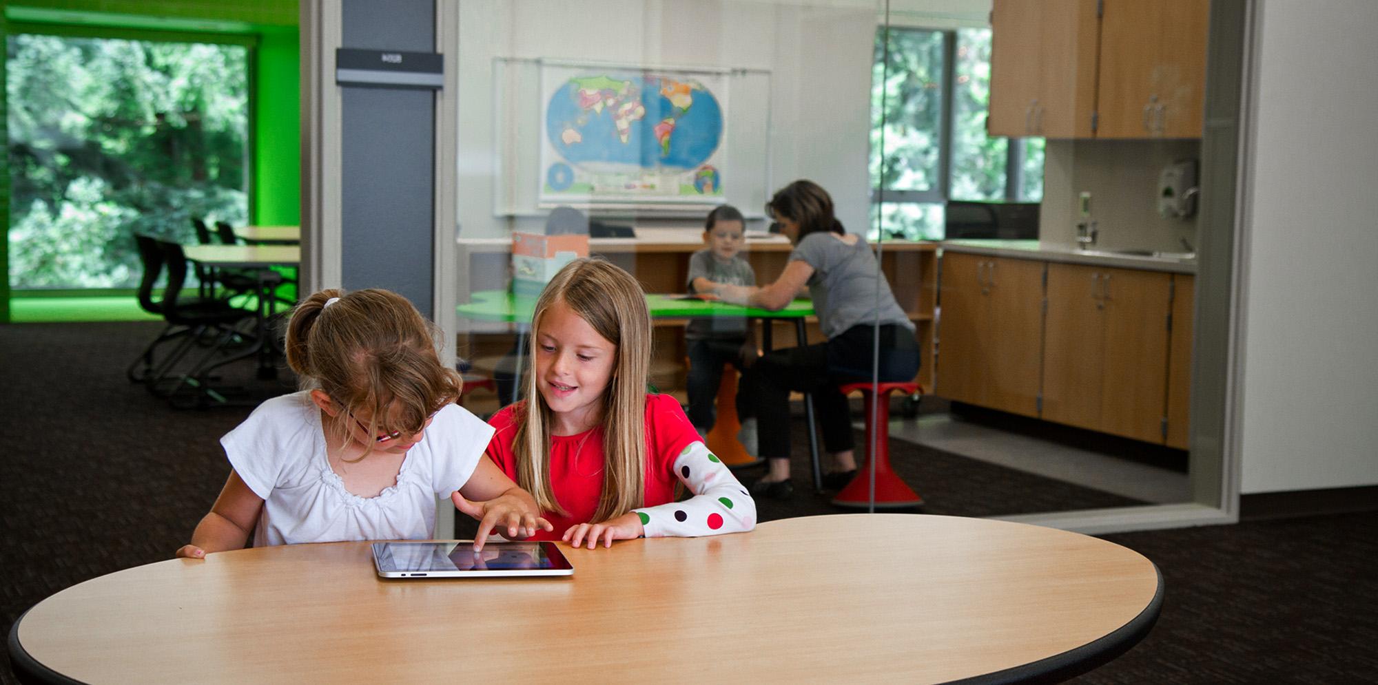 Trillium Creek Public School students in a classroom using ipad